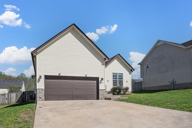 1277 Morstead Dr, Clarksville, TN 37042 - view of property exterior with fence, concrete driveway, stone siding, a lawn, and a garage