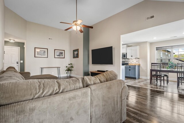 1277 Morstead Dr, Clarksville, TN 37042 - living room with visible vents, baseboards, wood finished floors, a ceiling fan, and high vaulted ceiling