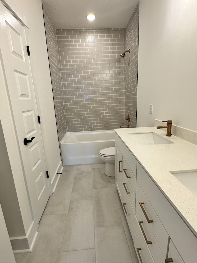 full bath with recessed lighting, a sink, toilet, double vanity, and bathtub / shower combination