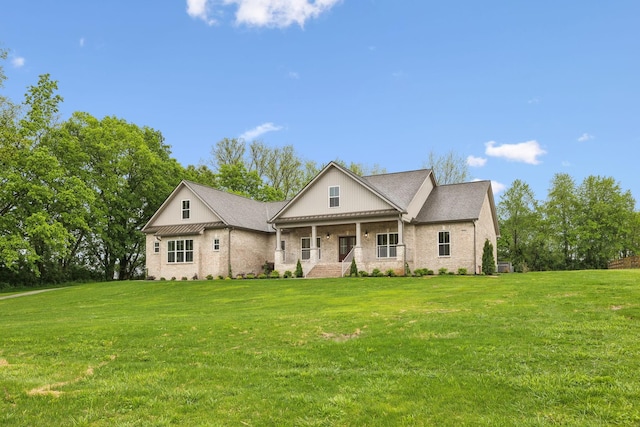 8020 Traditions Ln, Columbia, TN 38401 - greek revival house with a porch, a front lawn, and brick siding