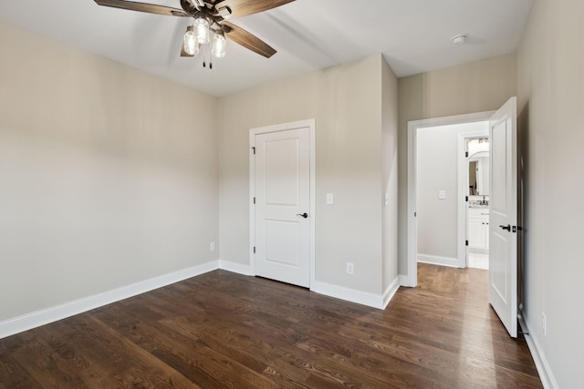 8020 Traditions Ln, Columbia, TN 38401 - unfurnished bedroom with a ceiling fan, dark wood-style flooring, and baseboards