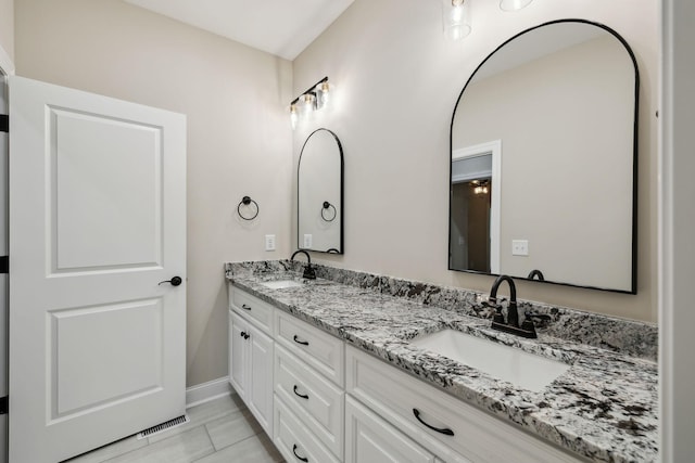 8020 Traditions Ln, Columbia, TN 38401 - full bath with baseboards, visible vents, double vanity, and a sink