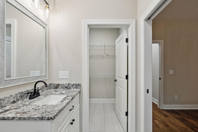 8020 Traditions Ln, Columbia, TN 38401 - bathroom with baseboards, a walk in closet, and vanity