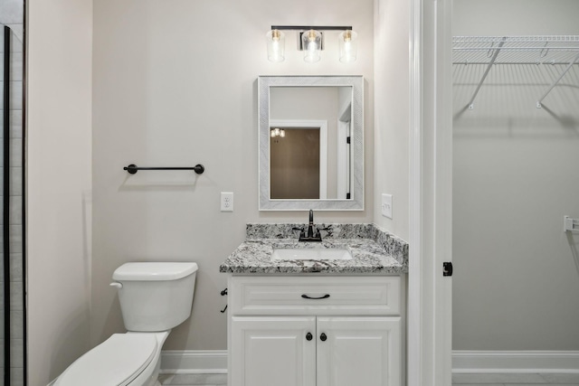 8020 Traditions Ln, Columbia, TN 38401 - full bath featuring toilet, a walk in closet, vanity, and baseboards