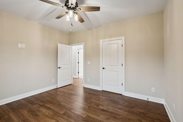 8020 Traditions Ln, Columbia, TN 38401 - unfurnished bedroom featuring a ceiling fan, dark wood-style floors, and baseboards