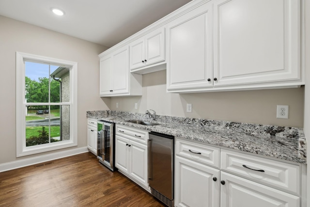 8020 Traditions Ln, Columbia, TN 38401 - kitchen with white cabinets, a sink, beverage cooler, visible vents, and light stone countertops