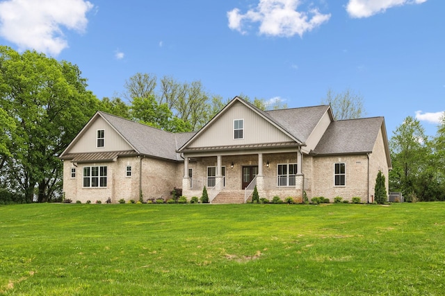 8020 Traditions Ln, Columbia, TN 38401 - view of front of house with a standing seam roof, a porch, and a front lawn