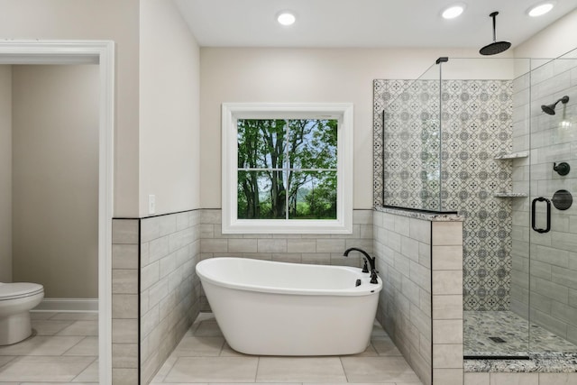 8020 Traditions Ln, Columbia, TN 38401 - full bath with tile patterned floors, a freestanding bath, a stall shower, and tile walls
