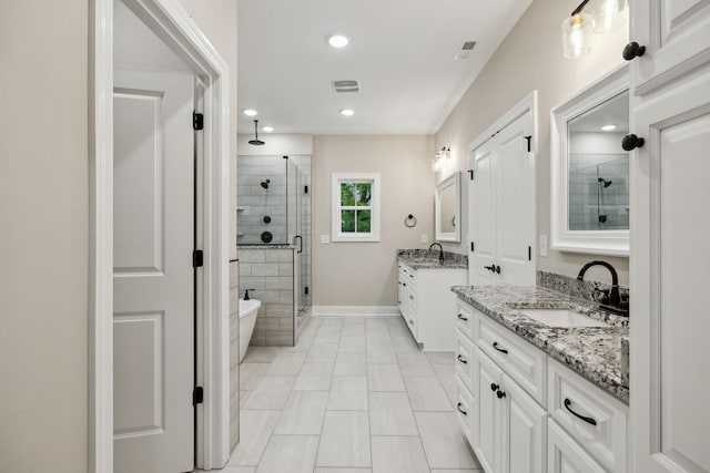 8020 Traditions Ln, Columbia, TN 38401 - bathroom with recessed lighting, a sink, tile patterned floors, a stall shower, and two vanities