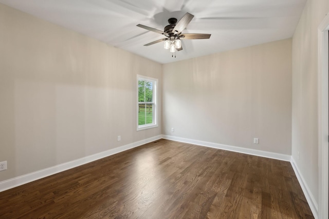 8020 Traditions Ln, Columbia, TN 38401 - spare room with dark wood-style floors, ceiling fan, and baseboards