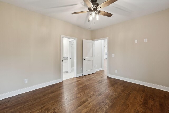 8020 Traditions Ln, Columbia, TN 38401 - spare room with dark wood-style floors, a ceiling fan, and baseboards