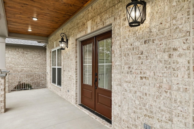 8020 Traditions Ln, Columbia, TN 38401 - entrance to property featuring covered porch, french doors, and brick siding