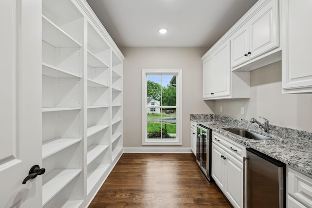 8020 Traditions Ln, Columbia, TN 38401 - kitchen featuring light stone countertops, a sink, white cabinetry, and beverage cooler