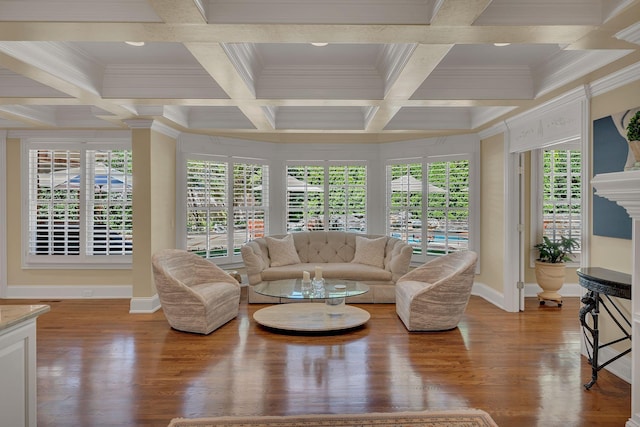 sunroom / solarium featuring coffered ceiling and beamed ceiling