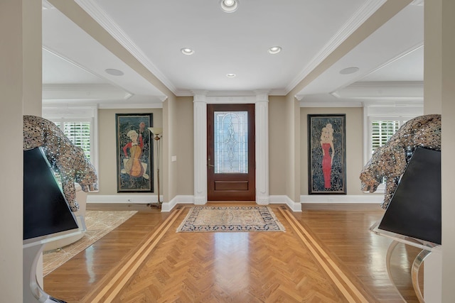 entryway featuring ornate columns, plenty of natural light, and baseboards