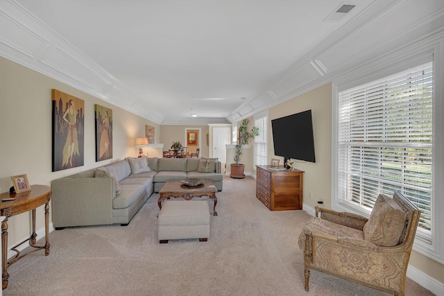 carpeted living area featuring baseboards, visible vents, and crown molding