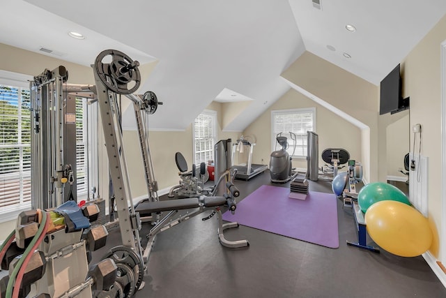exercise area with baseboards, visible vents, a healthy amount of sunlight, and recessed lighting