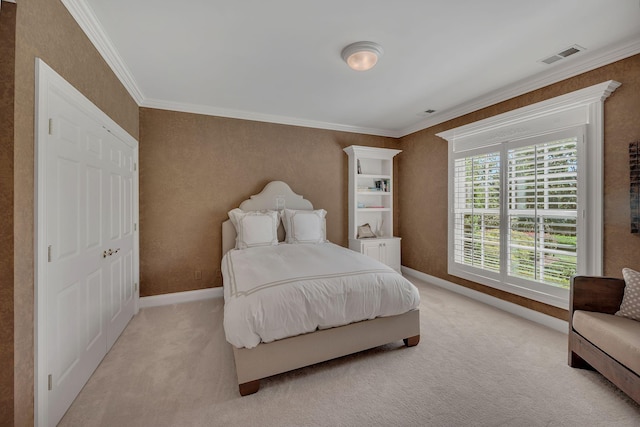 bedroom featuring visible vents, crown molding, baseboards, and light carpet