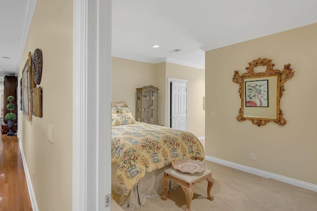 bedroom featuring baseboards, visible vents, crown molding, and recessed lighting