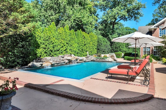 outdoor pool with a patio area