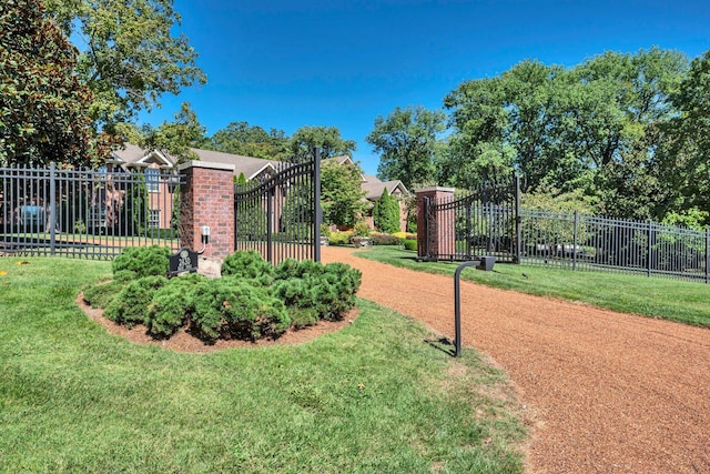 surrounding community with a yard and fence