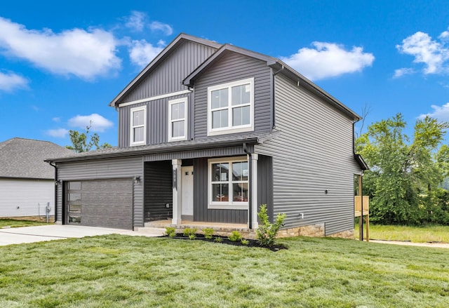 500 Herman Dr, Clarksville, TN 37042 - traditional home featuring concrete driveway, a front yard, covered porch, and board and batten siding