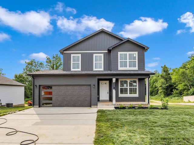 500 Herman Dr, Clarksville, TN 37042 - view of front facade featuring a front yard, a porch, a garage, concrete driveway, and board and batten siding