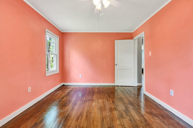 unfurnished room featuring hardwood / wood-style flooring, crown molding, a ceiling fan, and baseboards