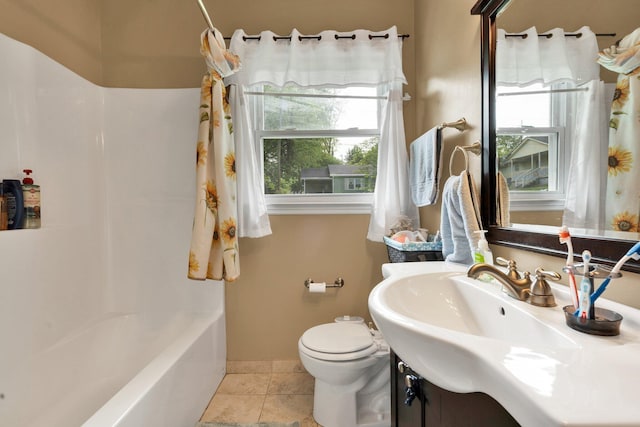 full bathroom with vanity, tile patterned floors, toilet, baseboards, and tub / shower combination