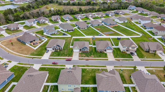 birds eye view of property with a residential view