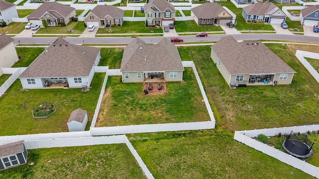 birds eye view of property with a residential view