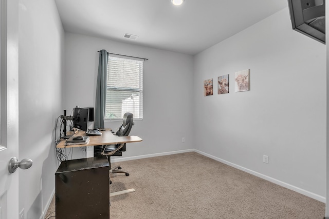 office area with baseboards, carpet flooring, and visible vents