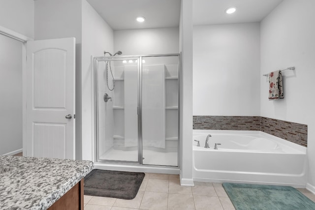 bathroom featuring recessed lighting, tile patterned floors, a shower stall, and a bath