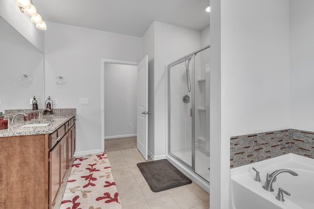 full bath featuring a sink, tile patterned floors, a stall shower, and a bath