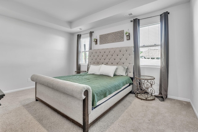 bedroom featuring carpet floors, baseboards, and visible vents