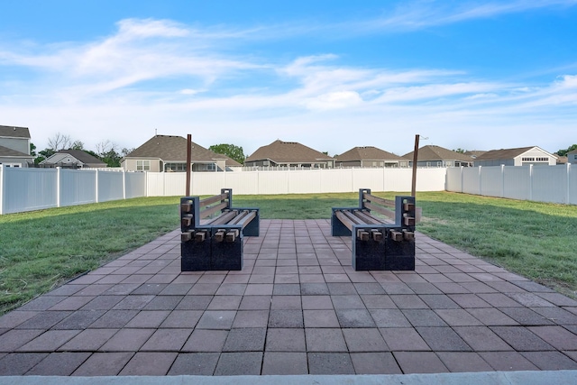 view of patio with a residential view and a fenced backyard