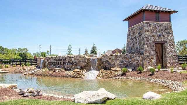 view of property's community with fence