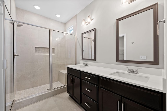 465 Herman Dr, Clarksville, TN 37042 - bathroom with double vanity, a shower stall, tile patterned floors, and a sink