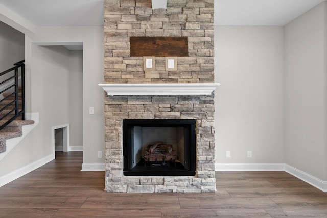 465 Herman Dr, Clarksville, TN 37042 - details featuring a stone fireplace, wood finished floors, and baseboards