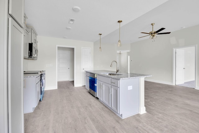 497 Herman Dr, Clarksville, TN 37042 - kitchen featuring a sink, appliances with stainless steel finishes, baseboards, light wood-style floors, and lofted ceiling