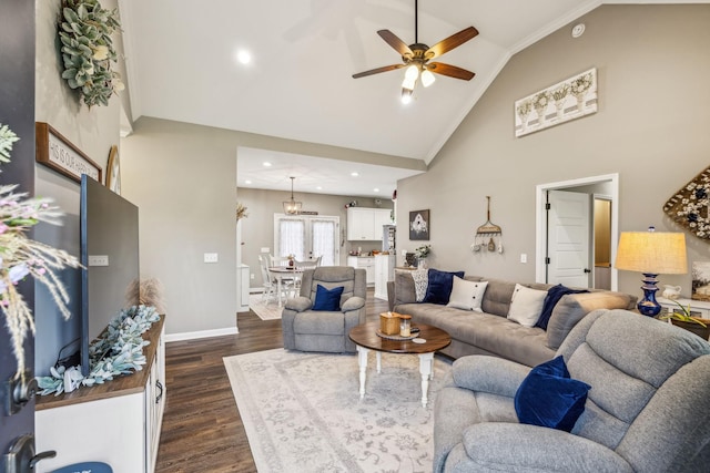living area featuring baseboards, dark wood-style floors, high vaulted ceiling, a ceiling fan, and crown molding