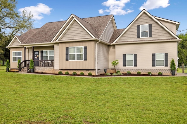 craftsman inspired home with roof with shingles, a front yard, and crawl space