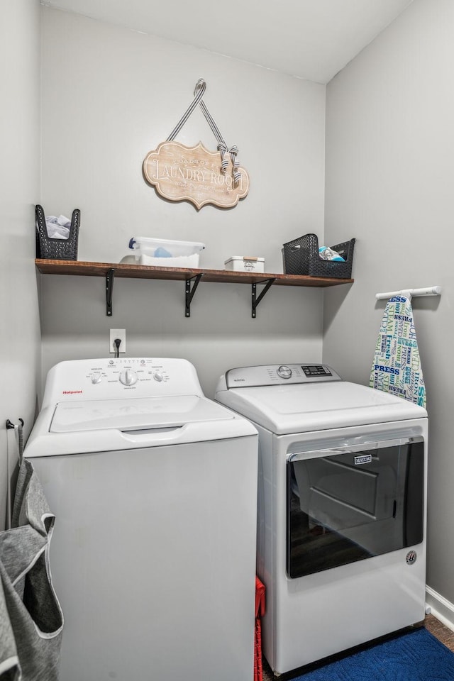 washroom featuring laundry area and washing machine and dryer