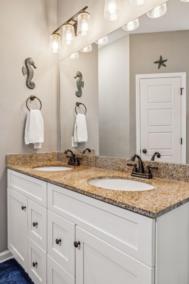 bathroom featuring double vanity and a sink