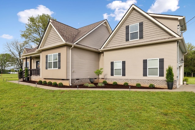 craftsman-style house featuring a porch, a front yard, crawl space, and a shingled roof