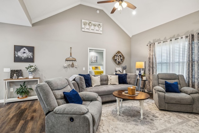 living area with high vaulted ceiling, wood finished floors, and a ceiling fan