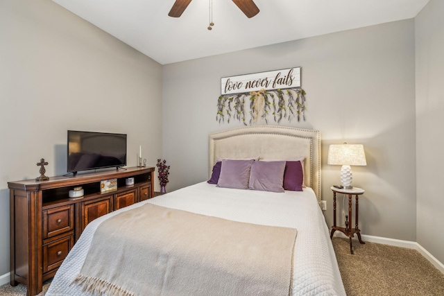 carpeted bedroom with a ceiling fan and baseboards