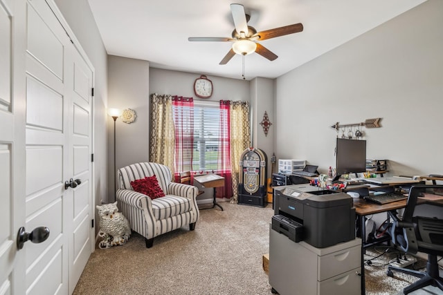 carpeted home office with ceiling fan