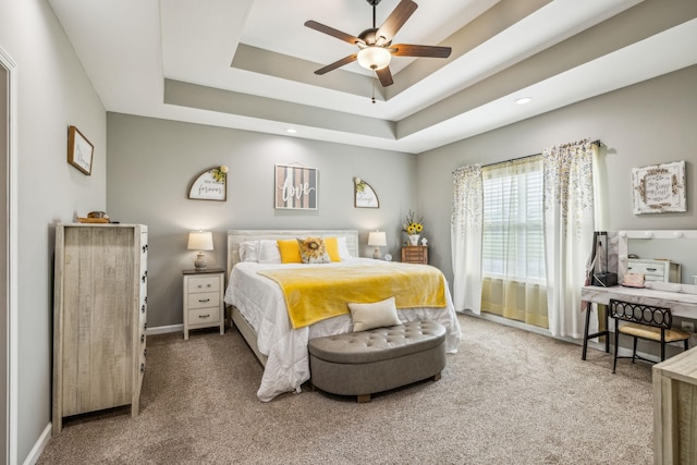 bedroom with recessed lighting, carpet flooring, baseboards, a raised ceiling, and a ceiling fan