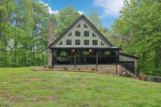 685 Hunters Landing Ln, Smithville, TN 37166 - rear view of house with a sunroom, a chimney, a yard, and stairway